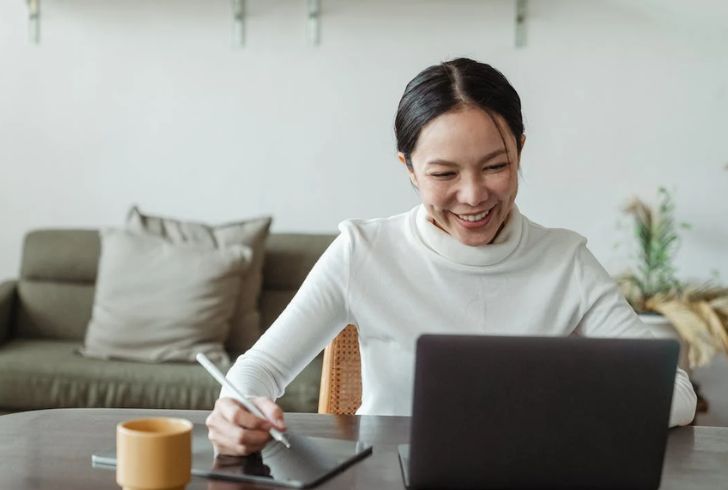 Remote worker enjoying flexibility with a laptop in a cozy home setting